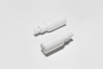 Wall Mural - Cosmetic Or Hygiene Spray Dispenser Pump Plastic Bottles on white background.Top view.High resolution photo.