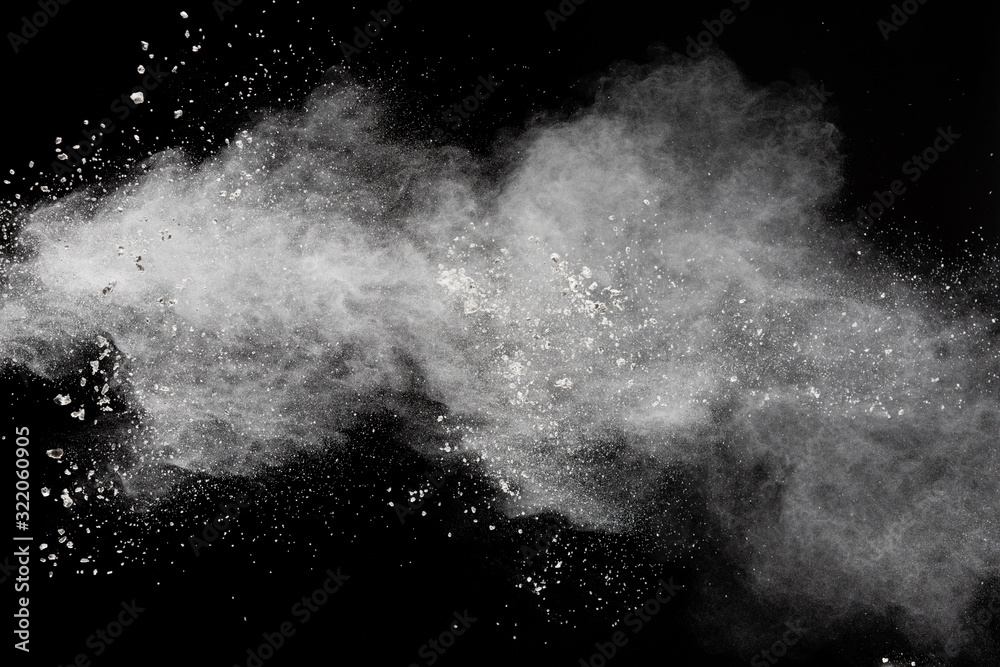 White powder explosion isolated on black background.White dust particles splash. - obrazy, fototapety, plakaty 