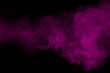 © Pattadis - Purple color powder explosion cloud  on black background.Purple dust particles splash.