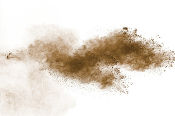 Wall Mural - Abstract deep brown dust explosion on white background.Freeze motion of brown dust splash.