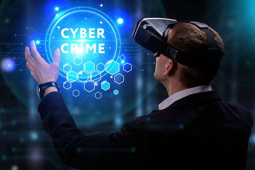 Business, Technology, Internet and network concept. Young businessman working on a virtual screen of the future and sees the inscription: Cyber crime