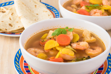 Wall Mural - Mexican shrimp vegetables spicy soup.