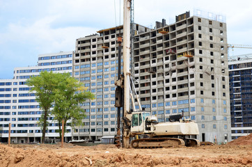 Wall Mural - Tracked  pile-driver, which can be used as large drilling equipment as well as pile-driving equipment. Piles driven into the ground by vibrating hydraulic hammer. Ground drilling machine. Drilling rig