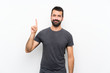 © luismolinero - Young handsome man over isolated white background showing and lifting a finger in sign of the best