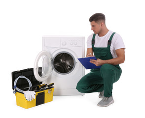 Canvas Print - Repairman with clipboard and toolbox near washing machine on white background