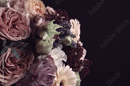 Beautiful bouquet on black background. Floral card design with dark vintage effect