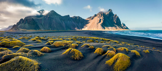 Wall Mural - view from flying drone. stunning autumn scene of stokksnes cape with vestrahorn (batman mountain) on