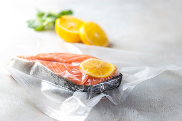 Salmon fillets in a vacuum package. Sous-vide, new technology cuisine.