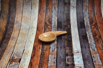 A small brown spoon made of wood