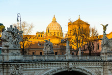 The Sunrise Hits St Peter's Cathedral And The Vatican But Has Yet To Reach Ponte Vittorio Emanuele II Bridge In The Foreground. Rome. Italy.