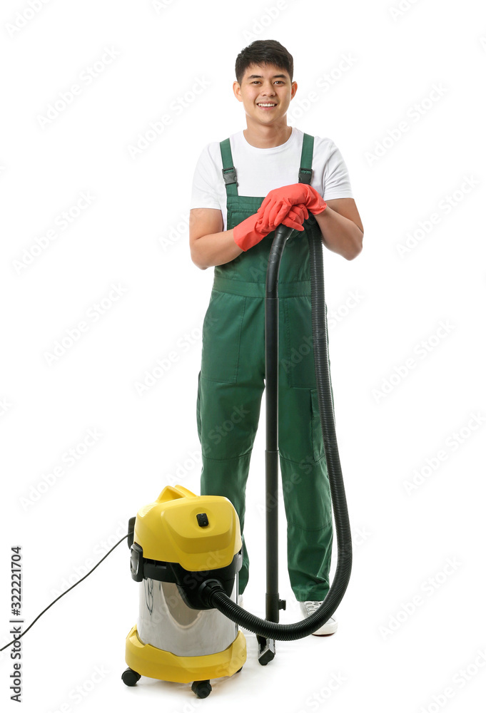 Asian janitor with vacuum cleaner on white background