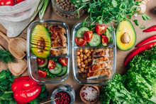 Healthy Meal Prep Containers With Chickpeas, Chicken, Tomatoes, Cucumbers And Avocados. Healthy Lunch In Glass Containers On Beige Rustic Background. Zero Waste Concept. Selective Focus.