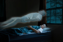 Glowing Spirit Or Angel Coming Out Of A Dead Man Who Has Died In His Sleep As It Floats Above Him Ascending Into Heaven As Moonlight Shines On The Poor Gentleman.