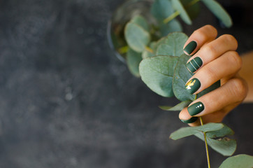 Wall Mural - Women's hands with colorful patterns on the nails. 2020 colors trend. Top view. A place for text.