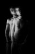© Iryna&Maya - Double personality back and white portrait. Long exposure creative moody creepy art works. Handsome naked torso man looking to the camera