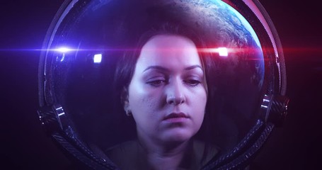Wall Mural - close up 4k shot of the young beautiful female astronaut in space helmet. she is exploring outer spa