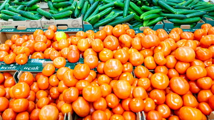 Russia Samara January 2020: Boxes with cucumbers and tomatoes. Close-up.