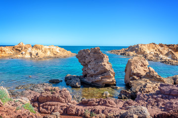 Wall Mural - Rocks in the water on the coast of Menorca, Balearic islands, Spain