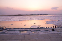 Picturesque Colorful Ice Drift On A Calm Wide River During The Pink Sunset With Pink Reflection On Water