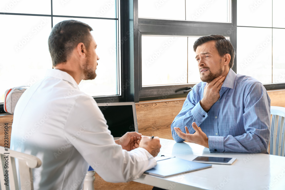 Patient visiting doctor in modern clinic