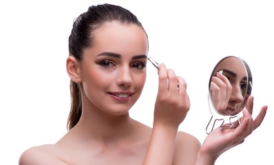 Woman in beauty concept applying make up using cosmetics