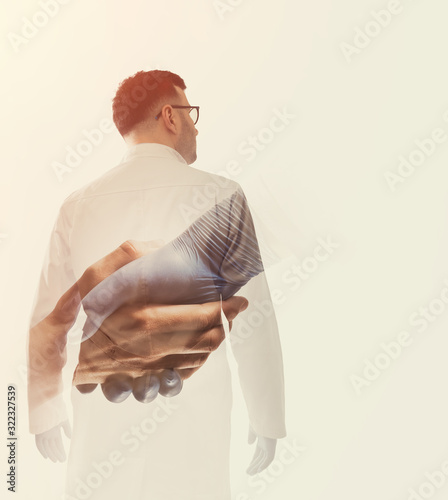 Photographie Double exposure image with doctor and helping hand