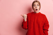 © Drobot Dean - Photo of shocked woman expressing surprise and pointing finger aside