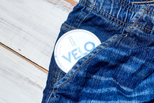 Kiev, Ukraine- January 20, 2020: Packaging Nicotine Pouches Velo In Jeans Pocket On A Light Wooden Background.