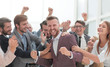 © ASDF - close up. cheerful company employees congratulating their colleague