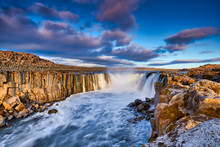 Colorful Clouds Over Selfoss Waterfall. Iceland, Jokulsa National Park, Fjollum River,  Europe. . Popular Tourist Attraction. Travelling Concept Background. Golden Ring Of Iceland. Beautiful Postcard.
