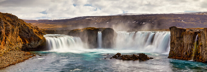 Wall Mural - Panorama of most famous place of Golden Ring Of Iceland. Godafoss waterfall near Akureyri in the Icelandic highlands, Europe. Popular tourist attraction. Travelling concept background. Postcard.