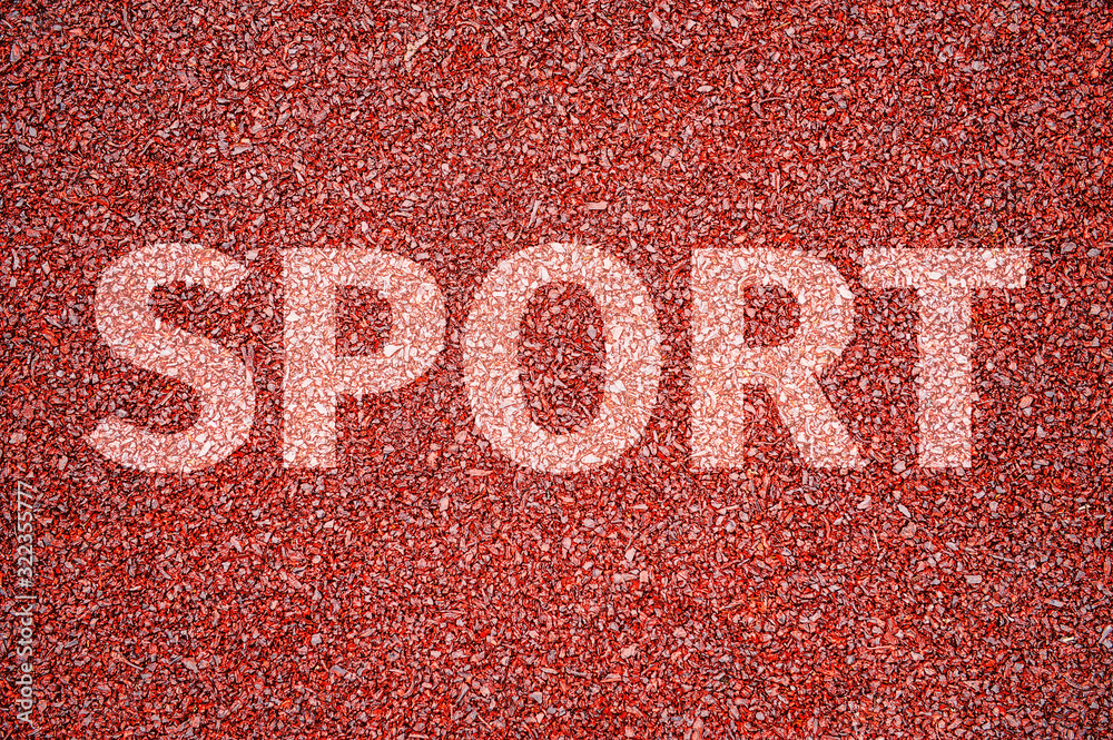 Sports inscription in capital letters on the red rubber treadmill of a ...