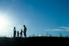 Silhouette Of A Happy Family With Children