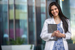 © elnariz - Commercial portrait of an indian american medical staff worker, smiling cheerful at dental health offices