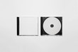 Closed compact plastic disc box case with white isolated blank for branding design. CD jewel mock-up on soft gray background. 