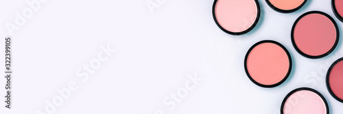 Cuadros en Lienzo Pink blush and compact powder on a pastel blue background
