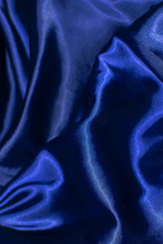 Beautiful Classic Blue Silk As A Background, Navy Blue Abstraction. Selective Focus.