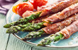 © Westend61 - Asparagus stalks wrapped in ham