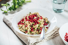 Plate Of Baba Ghanoush Salad With Brown Rice And Pomegranate Seeds