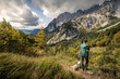 © Westend61 - Woman on a hiking trip at Wilder Kaiser enjoying the view, Kaiser mountains, Tyrol, Austria