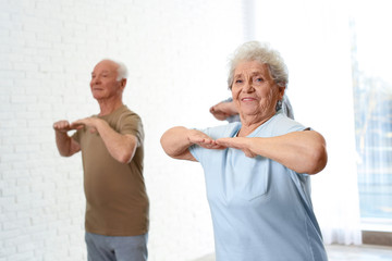 Sticker - Elderly people training in hospital gym. Senior patients care