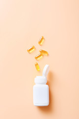 Wall Mural - Fish oil vitamin capsules on light color background