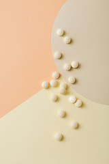 Wall Mural - Pharmaceutical medicine pills on colorful background. Top view composition