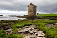 Low Angle Shot Of A Pirate Castle In The Coast Of County Mayo, Republic Of Ireland