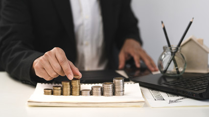 Wall Mural - Silver and gold coins stacked on the work desk,Money for business, growth and investment