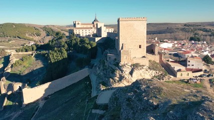 Wall Mural - Aerial view of Ucles castle and monastery with two keeps gates and towers encircling a bailey in Cuenca Spain