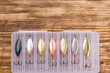 set of lures for fishing, close-up, on a dark wooden background