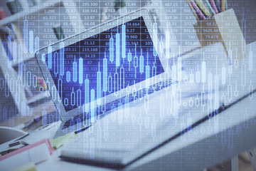 Financial market graph hologram and personal computer on background. Multi exposure. Concept of forex.