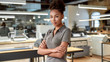 © Svitlana - A strategy is beautiful as you. African american office worker posing with folded arms