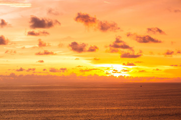 A beautiful ocean in Bali. The Pacific Ocean with large waves and tides that break on the rocks. The Indian Ocean is blue. Aqua Mente and Phantom Blue. Golden sunset on the ocean on the island of Bali